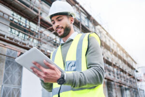 Construction site manager, inspecting building progress